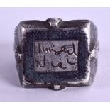 AN OLD MIDDLE EASTERN CALLIGRAPHY RING.