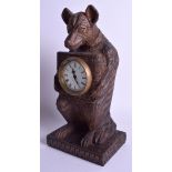 A BLACK FOREST STYLE BEAR MANTEL CLOCK. 30 cm x 15 cm.