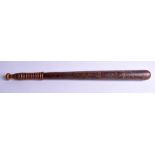 AN EARLY VICTORIAN RAILWAY TRUNCHEON, formed with ribbed handle and polychrome painted crest. 51 cm