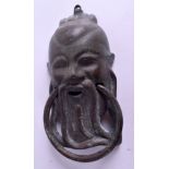 A CHINESE BRONZE DOOR KNOCKER. 16 cm x 9 cm.