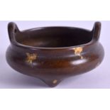 A CHINESE GOLD SPLASH BRONZE CENSER. 5.5 cm wide.