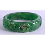 A CHINESE JADE BANGLE. 7.5 cm wide.