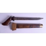 AN UNUSUAL ANTIQUE PISTOL DAGGER OR PUNCH DAGGER, formed with a wooden scabbard and brass tip. 35.5