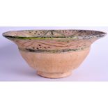 A MIDDLE EASTERN POTTERY BOWL. 24 cm wide.