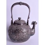 A FINE 19TH CENTURY JAPANESE MEIJI PERIOD SILVER TEAPOT AND COVER decorated in relief with extensiv