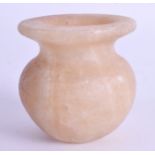 AN EGYPTIAN CARVED ALABASTER VASE. 6 cm high.