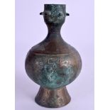 A RIBBED MIDDLE EASTERN BRONZE ISLAMIC VASE. 14 cm high.