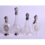 FOUR ANTIQUE SILVER AND GLASS SCENT BOTTLES. Largest 9.5 cm high. (4)