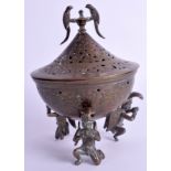 A MIDDLE EASTERN PERSIAN BRASS CENSER AND COVER decorated with flowers. 11 cm x 15 cm.