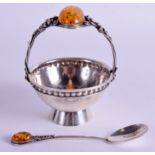 AN ARTS AND CRAFTS STYLE POLISH SILVER AND AMBER SUGAR BASKET with matching spoon. 4.2 oz. (2)