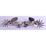 A GOOD PAIR OF 19TH CENTURY SPANISH SILVER OVERLAID SPURS decorated with flowers and vines. 40 oz o