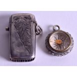 A MINIATURE SILVER VESTA CASE and a compass. (2)