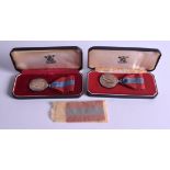 TWO BOXED SILVER MEDALS. (2)