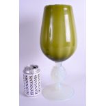 A 1950S ITALIAN OPALINE AND GREEN GLASS GOBLET VASE with unusual portrait stem. 34 cm high.