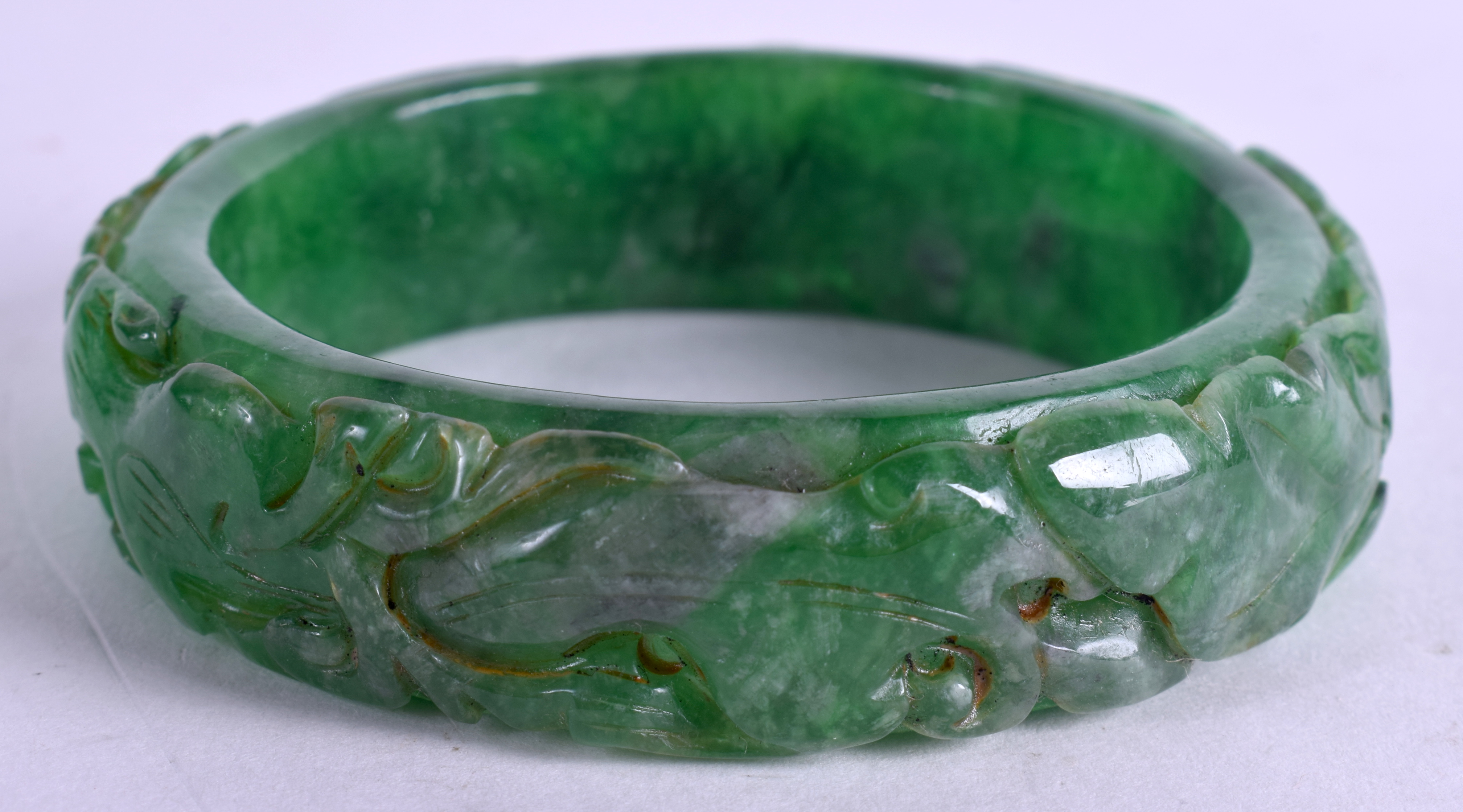 A CHINESE JADE BANGLE. 7.5 cm wide. - Image 2 of 3