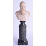 A 19TH CENTURY CARVED MARBLE FIGURE OF GEORGE V modelled upon a marbled column. 27 cm high.