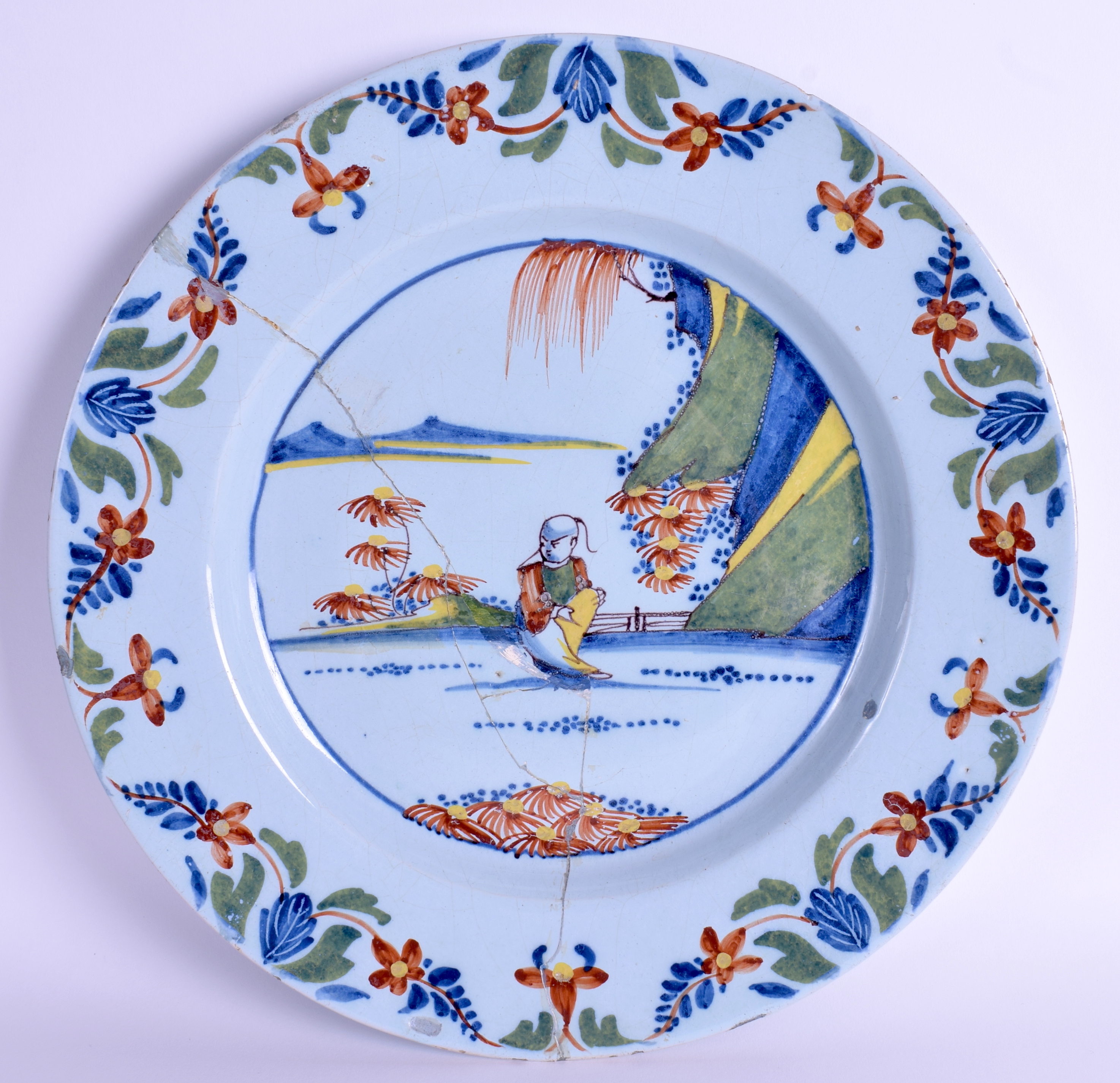 A LARGE 18TH CENTURY LONDON LAMBETH POLYCHROME DELFT DISH painted with a seated Chinese male. 34.5