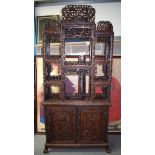 A GOOD 19TH CENTURY CHINESE HONGMU HARDWOOD DISPLAY CABINET ON STAND carved with birds and foliage.