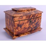 A REGENCY CARVED TORTOISESHELL TWIN DIVISION TEA CADDY upon turned bun feet. 20 cm x 15 cm.