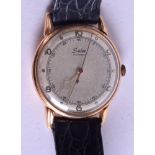 AN 18CT GOLD SUTER INCABLOC WRISTWATCH. 1.75 cm diameter.