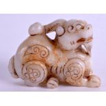 A CHINESE JADE TYPE BUDDHISTIC LION. 9 cm x 6.5 cm.