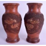 A PAIR OF JAPANESE MEIJI PERIOD REDWARE VASES. 24.5 cm high.