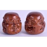TWO CARVED CHINESE BUDDHA HEADS. 4.5 cm wide. (2)