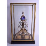 AN UNUSUAL BRASS AND ENAMEL SKELETON GLASS CASED CLOCK. Clock 47 cm x 18 cm.