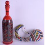 AN AFRICAN BEAD WORK INSTRUMENT together with a painted bottle. 23 cm & 33 cm high. (2)