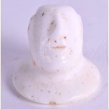 A CENTRAL ASIAN STONE IDOL HEAD. 2 cm high.