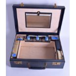 A LOVELY TRAVELLING SILVER AND ENAMEL VANITY CASE, containing various bottles, brush's etc. Case 40