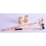 A PAIR OF 19TH CENTURY CHINESE IVORY CANS together with an antique folding ivory parasol handle. (3