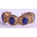 AN EARLY 20TH CENTURY CHINESE SILVER GILT AND LAPIS LAZULI BRACELET. 20 cm long.