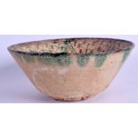 A MIDDLE EASTERN POTTERY BOWL. 24 cm wide.