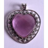 A SILVER HEART PENDANT. 5.5 cm wide.