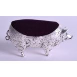 A SILVER PIG CUSHION. 10.5 cm wide.