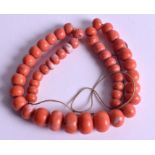 A LONG ANTIQUE CORAL NECKLACE. 40 cm long.