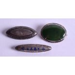 THREE SILVER BROOCHES. 4.5 cm wide. (3)