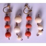A PAIR OF ANTIQUE CORAL AND IVORY EARRINGS.