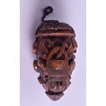 AN 18TH/19TH CENTURY CARVED COQUILLA NUT TREEN SNUFF BOX carved with arms and hounds. 6.5 cm x 3.5