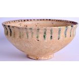 A MIDDLE EASTERN POTTERY BOWL. 24 cm wide.