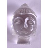 A CARVED CRYSTAL HEAD OF A BUDDHA. 3 cm x 1.5 cm.