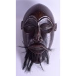 A LARGE EARLY 20TH CENTURY AFRICAN BEARDED HARDWOOD MALE MASK. 44 cm x 24 cm.