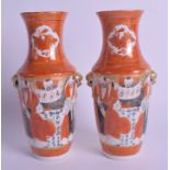 A PAIR OF 19TH CENTUR JAPANESE MEIJI PERIOD KUTANI VASES painted with figures. 21 cm high.