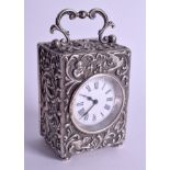 AN ANTIQUE MAPPIN AND WEBB SILVER MINIATURE TRAVELLING CLOCK. 9.25 cm high.
