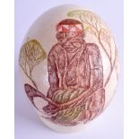 A CARVED CONTINENTAL OSTRICH EGG. 13 cm x 11 cm.