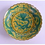 A CHINESE SCALLOPED GREEN GLAZED DRAGON DISH. 13 cm wide.