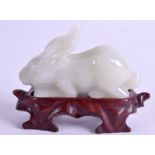 A CHINESE CARVED HARDSTONE RABBIT. 7.5 cm wide. (2)