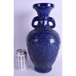 A LARGE CHINESE TWIN HANDLED BLUE VASE. 37 cm high.