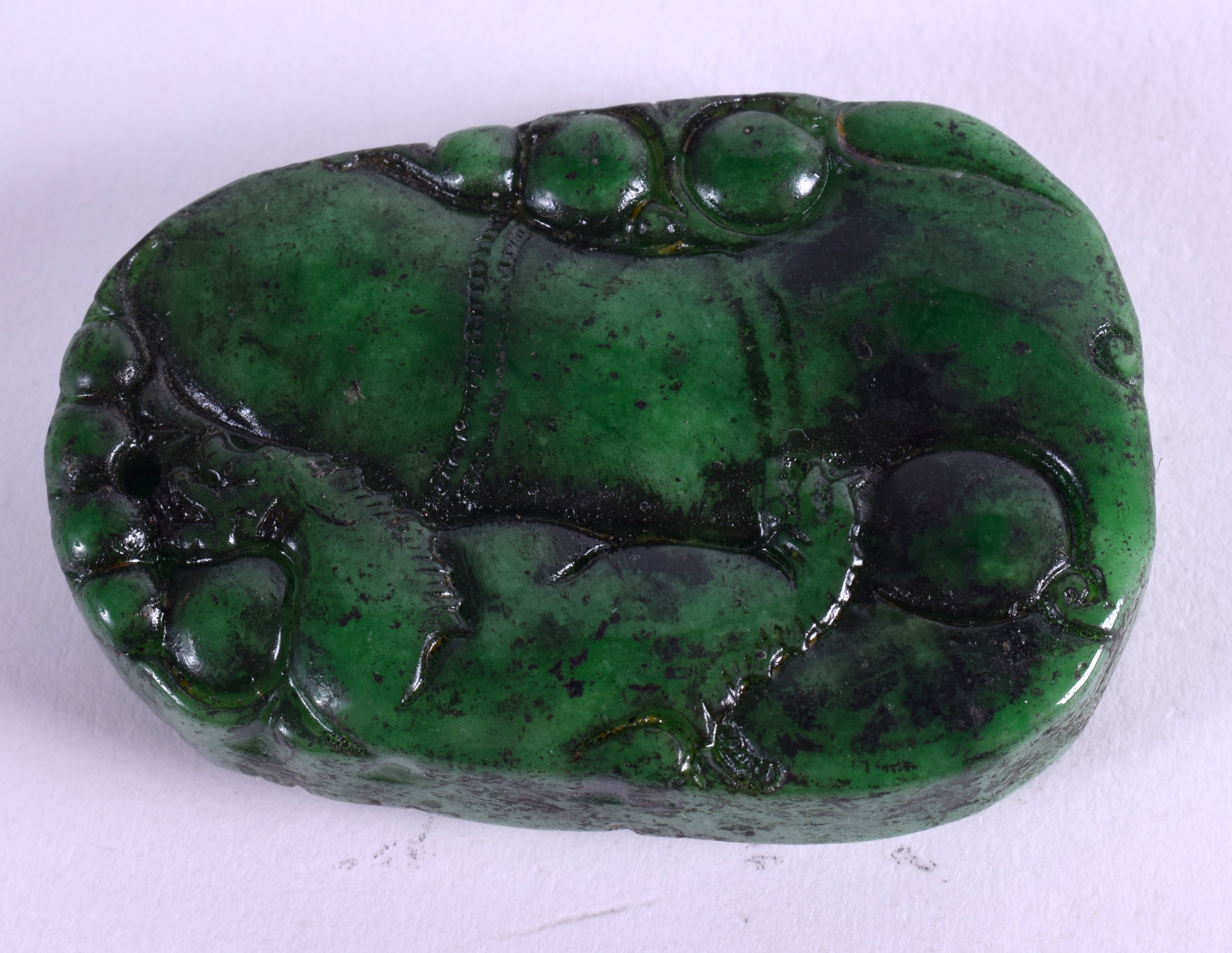 A MIDDLE EASTERN JADEITE PLAQUE. 3.5 cm x 5.5 cm. - Image 2 of 2